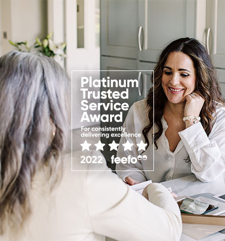 designer talking with customer with badge overlay