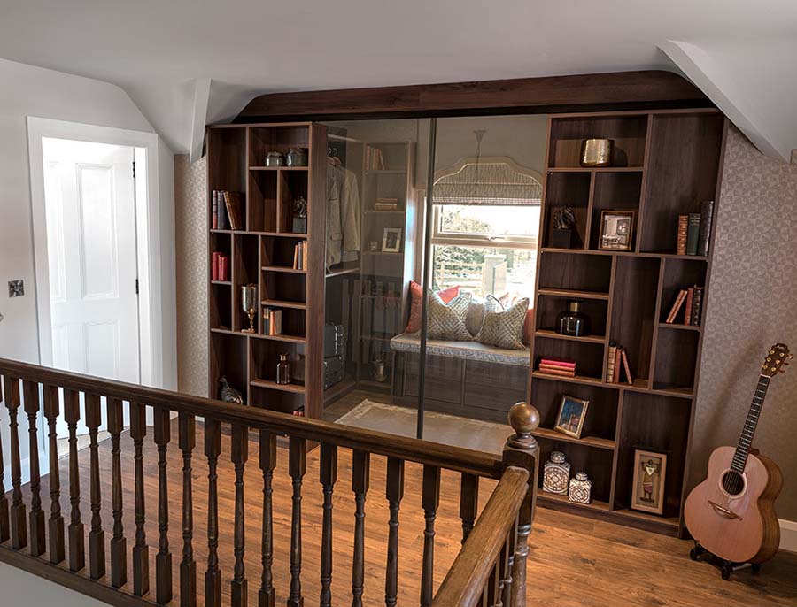 alcove walk in wardrobe with shelving and clear glass
