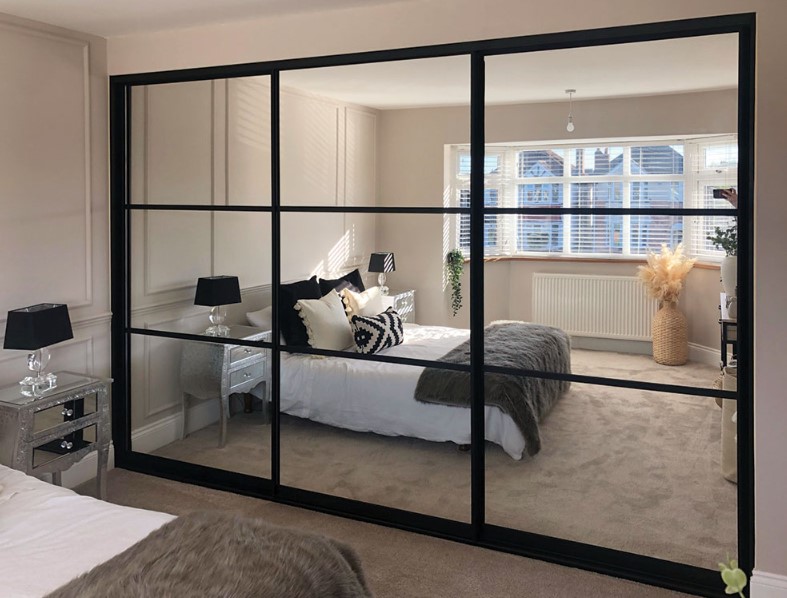 black framed mirrored sliding wardrobe