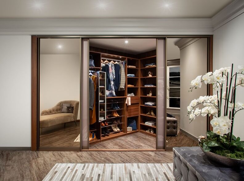 walk in sliding wardrobe with purple doors and mirror