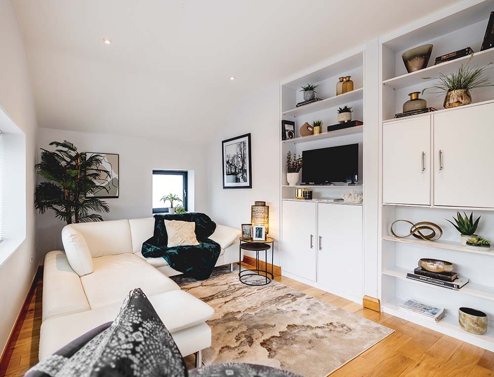 living area with shelving and cupboards
