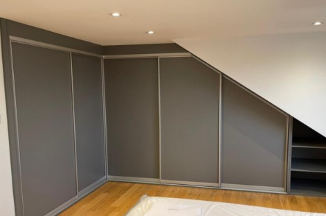 dark grey sliding angled wardrobe