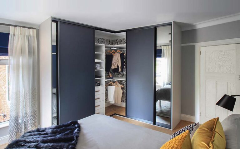 corner sliding wardrobe with clothes inside